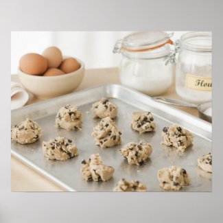 Raw cookies on baking tray posters