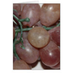 Red grapes, plastic, on pale background cards