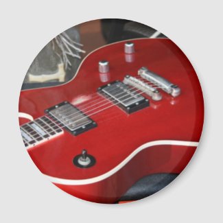 Red guitar on amp magnets