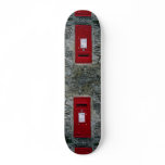 red letter box mounted on wall skate boards
