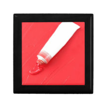 Red oil paint spilling out of tube keepsake box