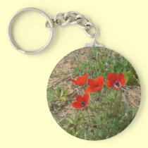 Red poppies in green keychains
