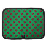 Red shamrocks on green background planner