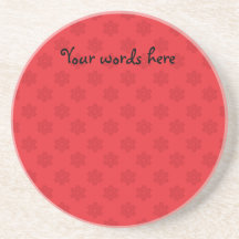 Red snowflake pattern on red coasters