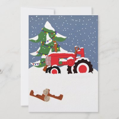 Red tractor in the snow with a pine tree and Christmas lights