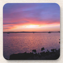 Red, Yellow, and Pink Sunset with Ocean and Clouds Coasters