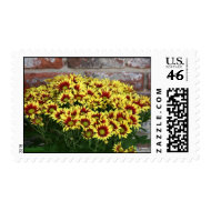 Red Yellow Flowers against brown red brick wall stamp