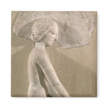 Relief depicting a woman in profile refrigerator magnet