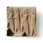 Relief depicting Median guards from stairs Button