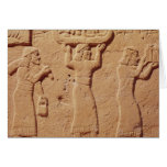 Relief depicting porters laden with gifts cards