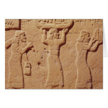 Relief depicting porters laden with gifts cards