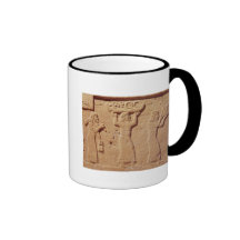 Relief depicting porters laden with gifts mug