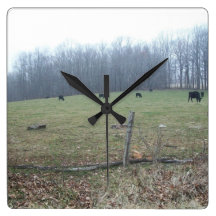 Reloj con las montañas y las vacas
