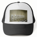 restroom interior with urinal row trucker hat