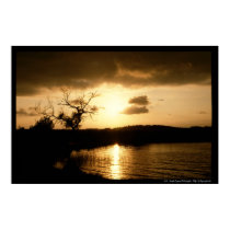 rising sun on lake posters