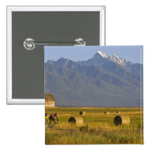 Road bicyclists race down back country road in pinback buttons
