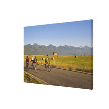 Road bicyclists ride down a back country road gallery wrap canvas