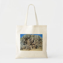 Rock formation against a clear blue sky bags
