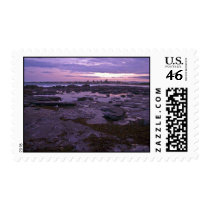 Rockpools at sunset postage