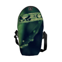 Rope drop on green grass bag courier bag