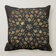 Rose window above the west door, with scenes depic pillows