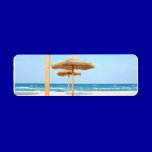 Row-of-beach-umbrellas BEACH GRASS UMBRELLAS OCEAN labels