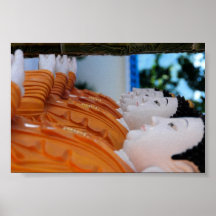 Row of pottery Buddhas Posters