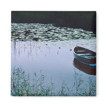 Rowboat on small lake surrounded by water refrigerator magnet