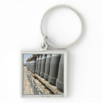 Rows of ammunition are stacked and prepped keychains
