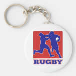 Rugby player tackle fending off key chains