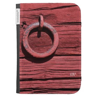 A Rustic Red Barn Wood with Metal Ring effect on an Amazon Kindle Sleeve