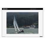 Sailboat in harbour against green mountain decals for 15" laptops