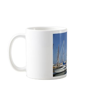 Sailing boats in the harbour mug
