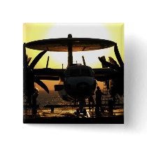 Sailors work on an E-2C Hawkeye aircraft Button