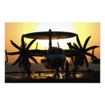 Sailors work on an E-2C Hawkeye aircraft