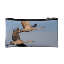 sandhill crane couple in flight cosmetic bag