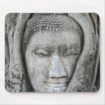 Sandstone head of Buddha surrounded by tree Mousepad