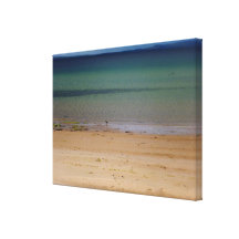 Sandy beach with oystercatcher stretched canvas print