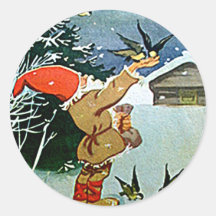 Santa feeding birds by hand in snow sticker