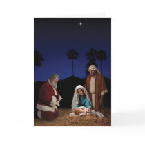 Santa Kneeling at Nativity Greeting Cards