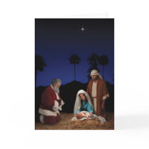 Santa Kneeling at Nativity Greeting Cards