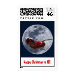 Santa on sleigh flying by the moon stamps