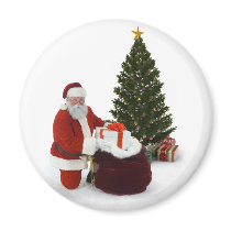 Santa setting presents by the tree fridge magnet