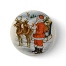 round_button - Santa is standing beside his Reindeer offering a cube of sugar to the closer one. His sleigh is full of gifts and toys. Snow covered hill are the background.: Sizes 