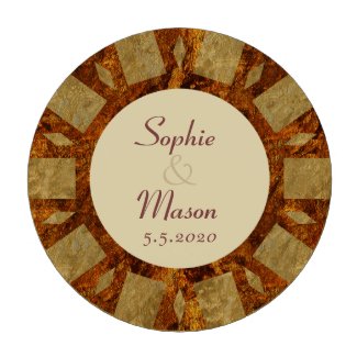 A pattern of squares and diamonds in a background of hues of gold, reds and orange on a wedding favour poker chip with wedding photograph and a wedding save the date announcement, vegas casino style