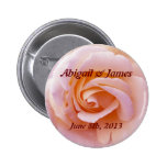 Save the date button with peach & pinky rose