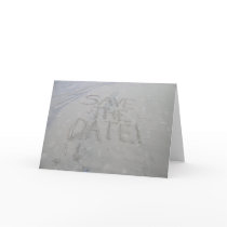 Save the date card, written in the sand