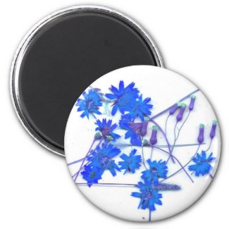 Scattered blue colored wild flowers magnet