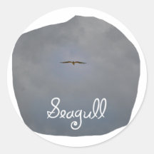 Seagull flying in a grey sky with text Seagull Sticker