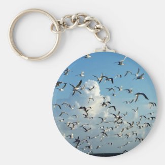 seagulls flying over beach keychain